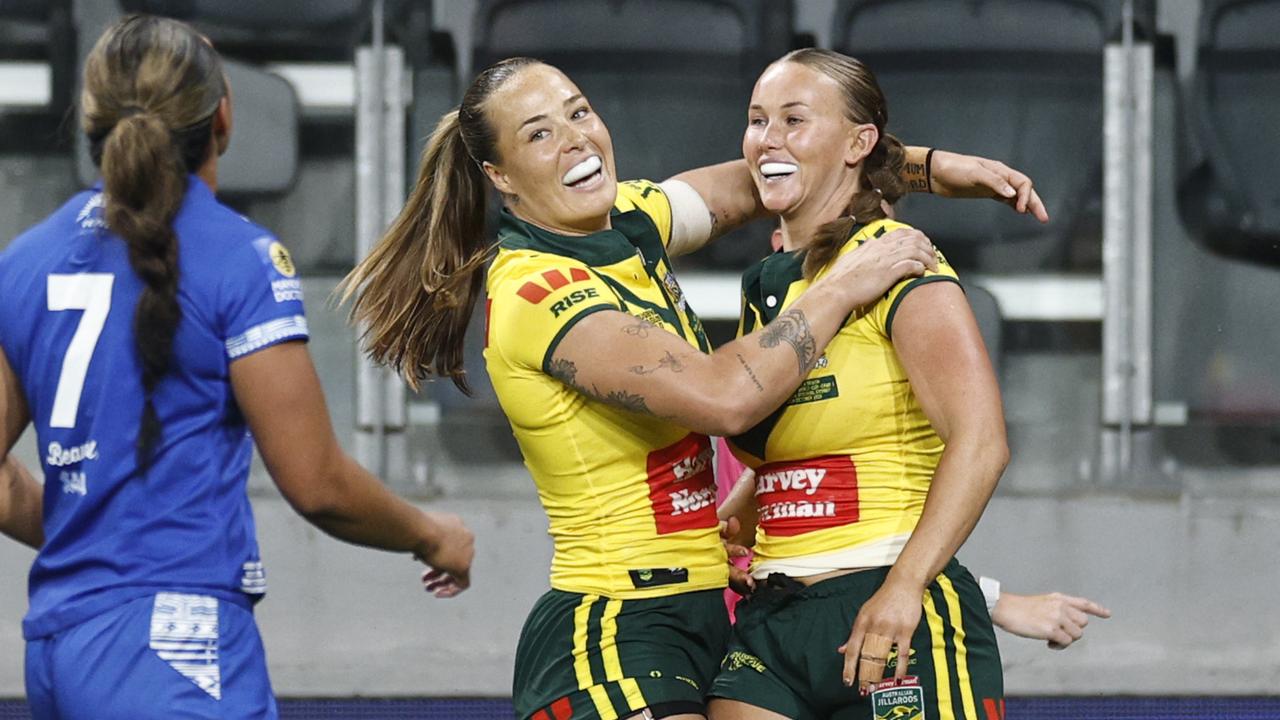 Jaime Chapman of Australia celebrates scoring a try