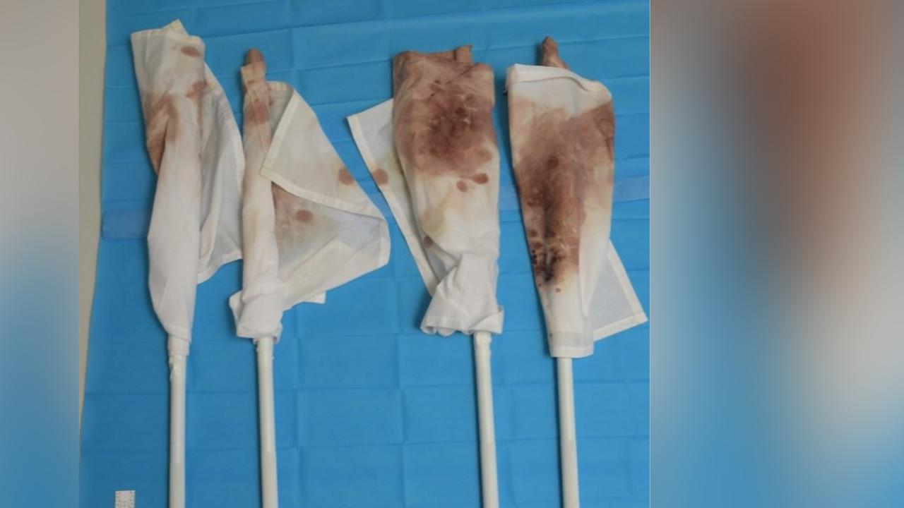 red stains on white umpire flags