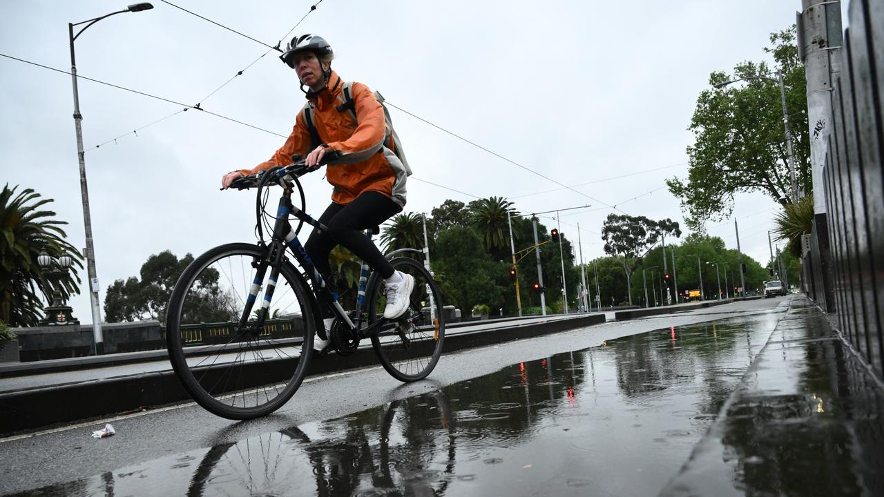Commuters during wet weather in Melbourne,