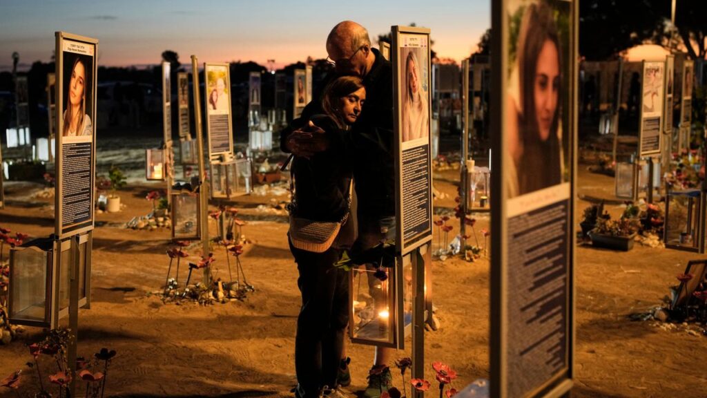 People gather at the site of the music festival that was overrun by a Hamas-led attack in 2023.
