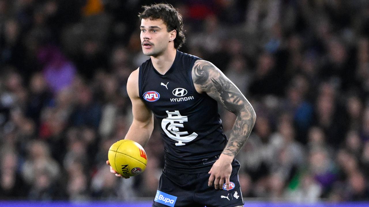Lachlan Cowan of the Blues in action durin