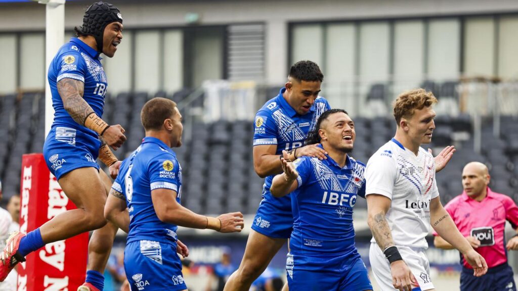 Samoa celebrate a try during their 78-4 mauling of France at the World Cup. 
