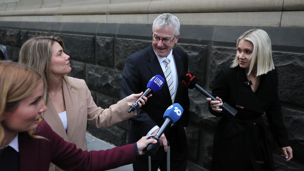 man questioned by reporters outside court