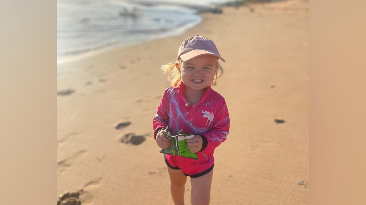 smiling toddler at beach