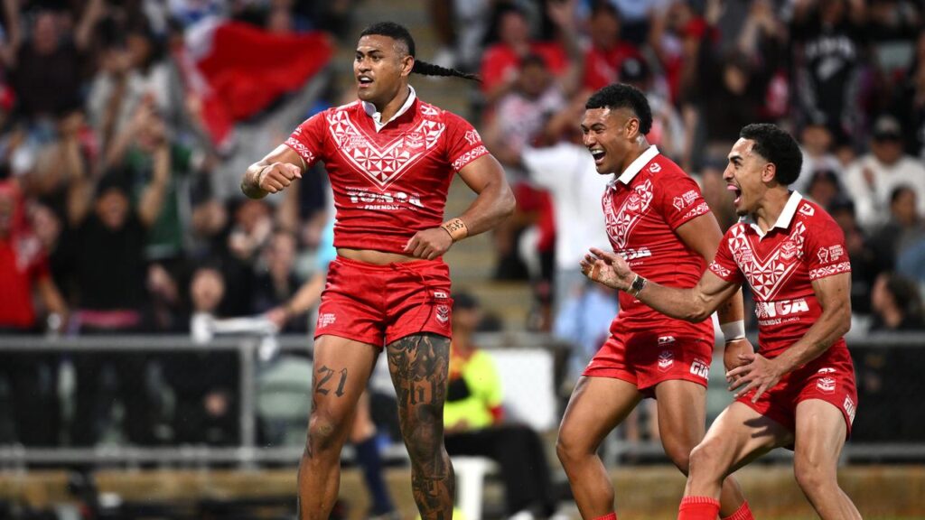 Tonga have made an early World Cup statement, thumping England 30-12 in Perth.
