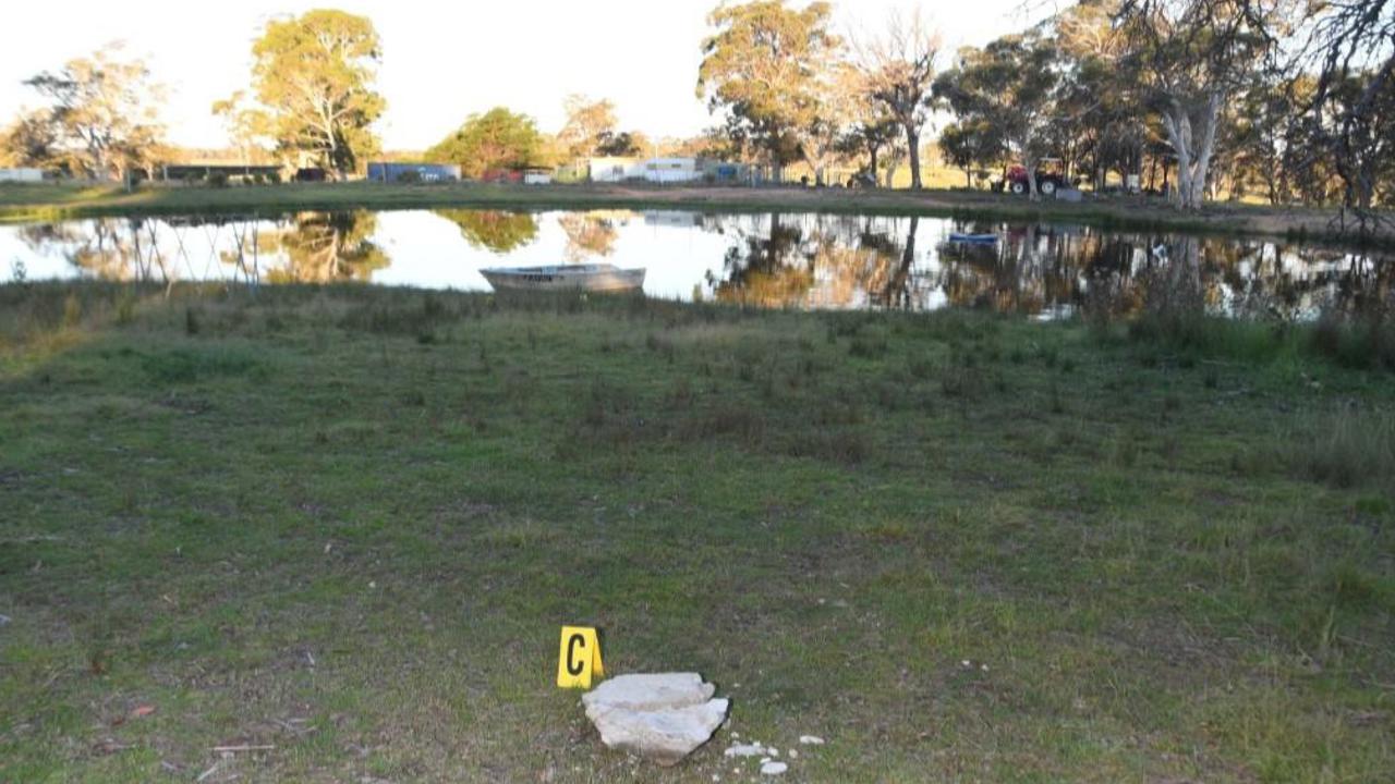 concrete block in foreground, dam in background