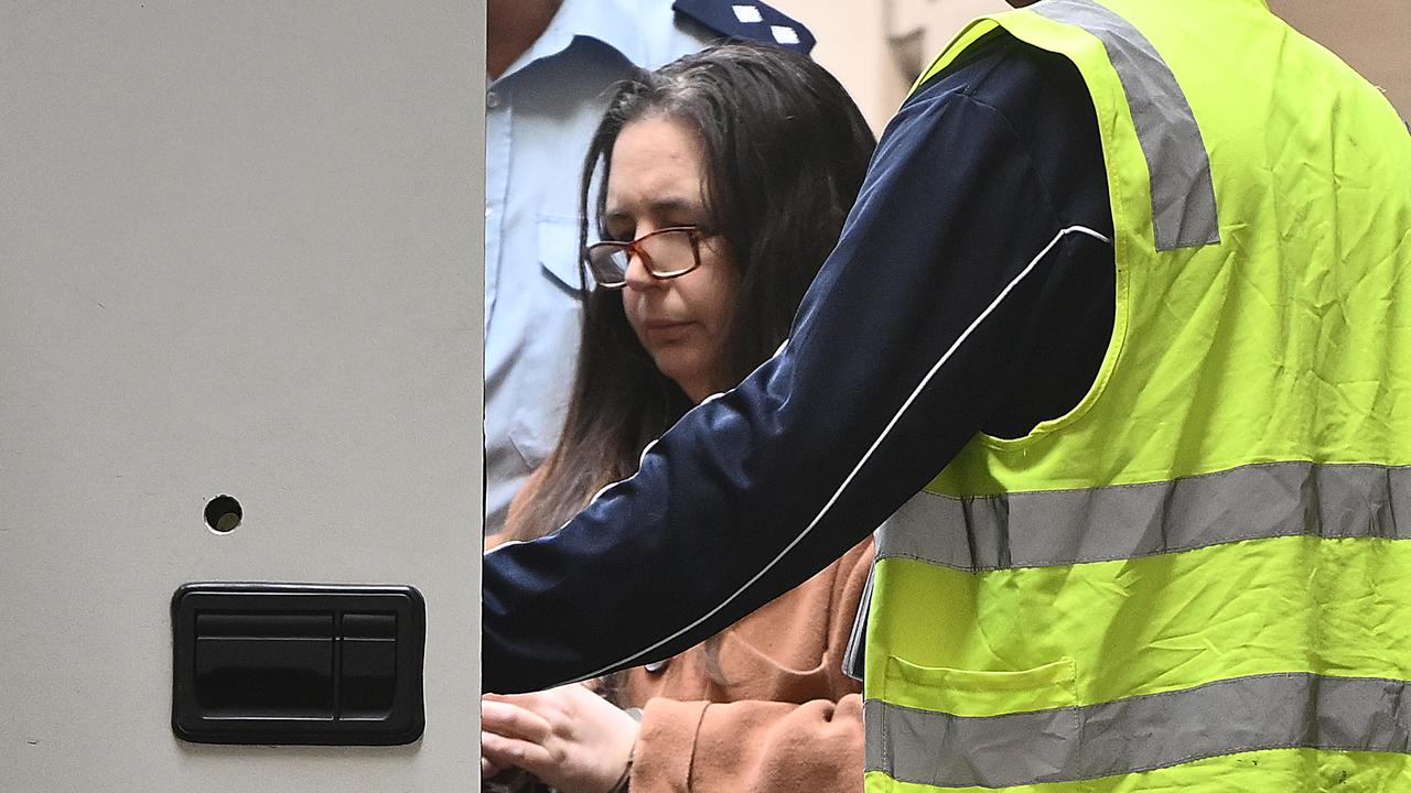 woman getting into prison truck