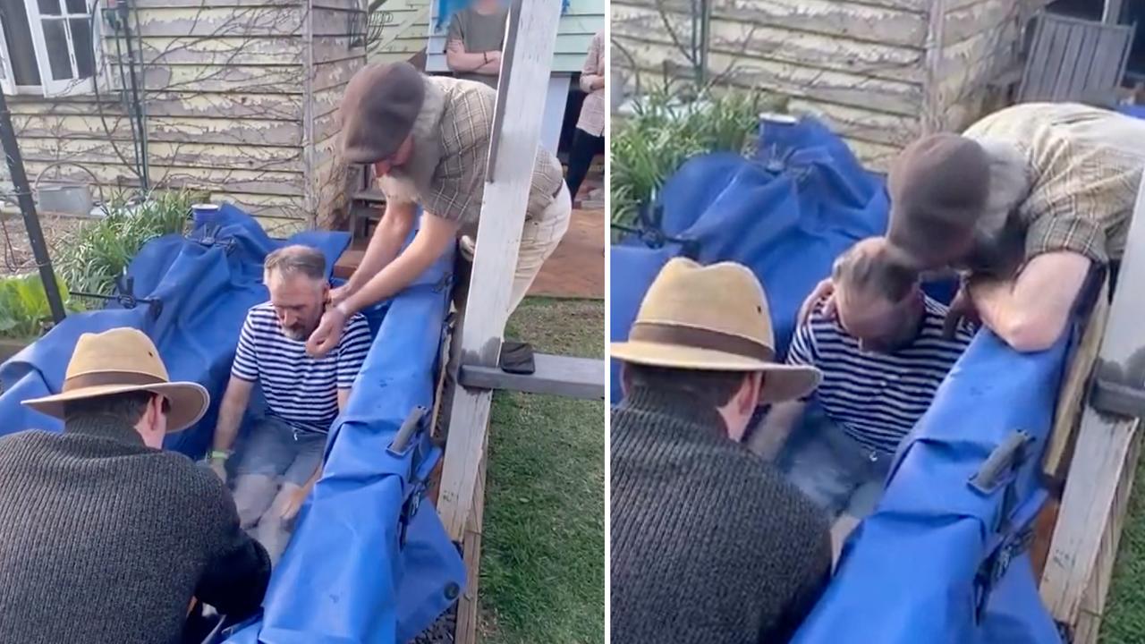 man in backyard baptism