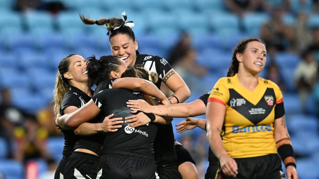 Abigail Roache of New Zealand celebrates scoring a try against PNG in their World Cup clash.
