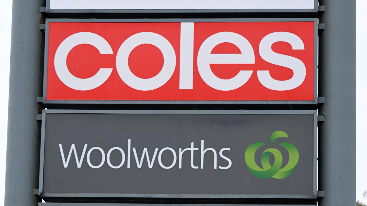 Signage for Coles and Woolworths (file image)
