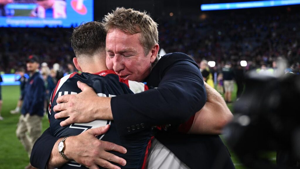 Sam Walker and Trent Robinson shared a warm embrace after the Roosters clinched the premiership.

