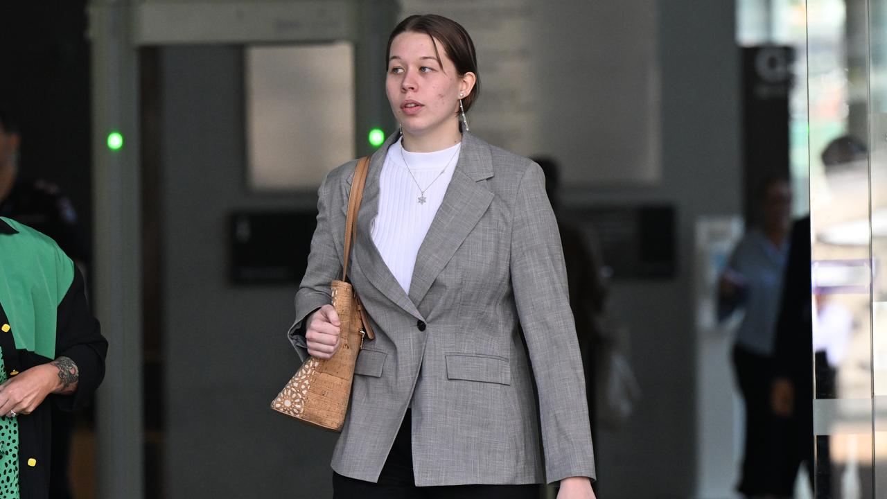woman walks out of court