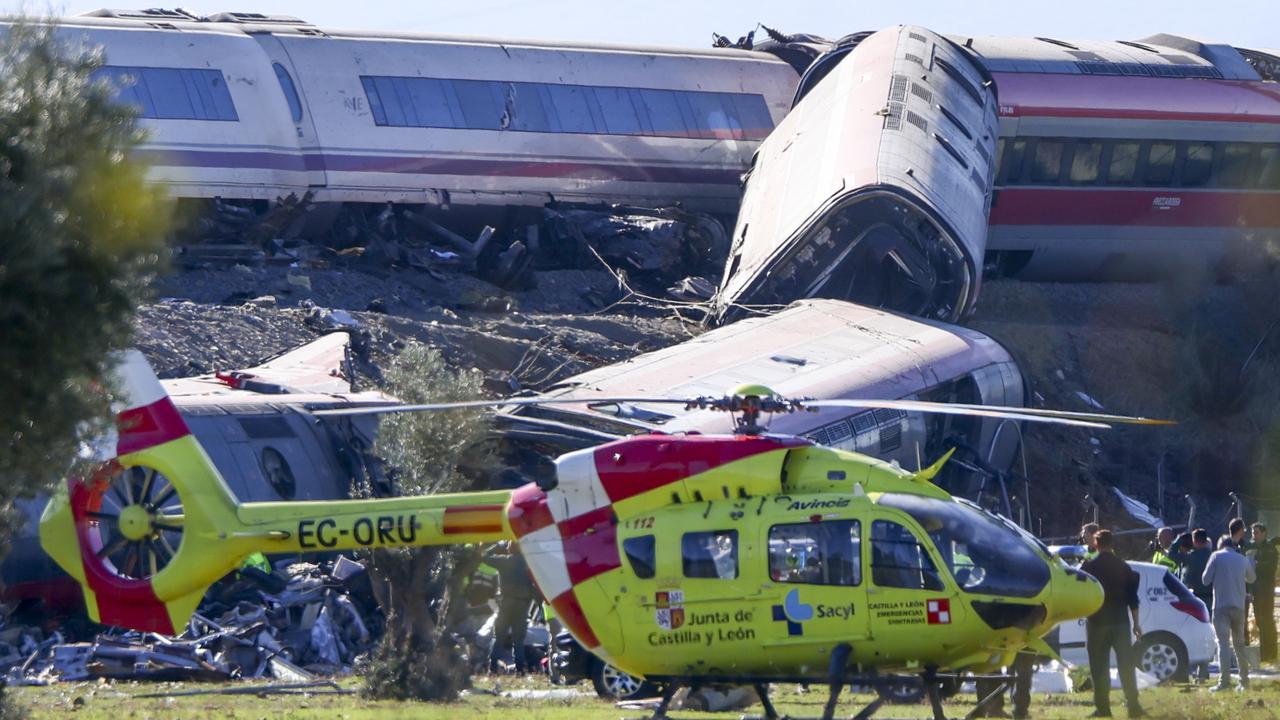 Rescue teams at the scene of a train collision in Urda, Spain