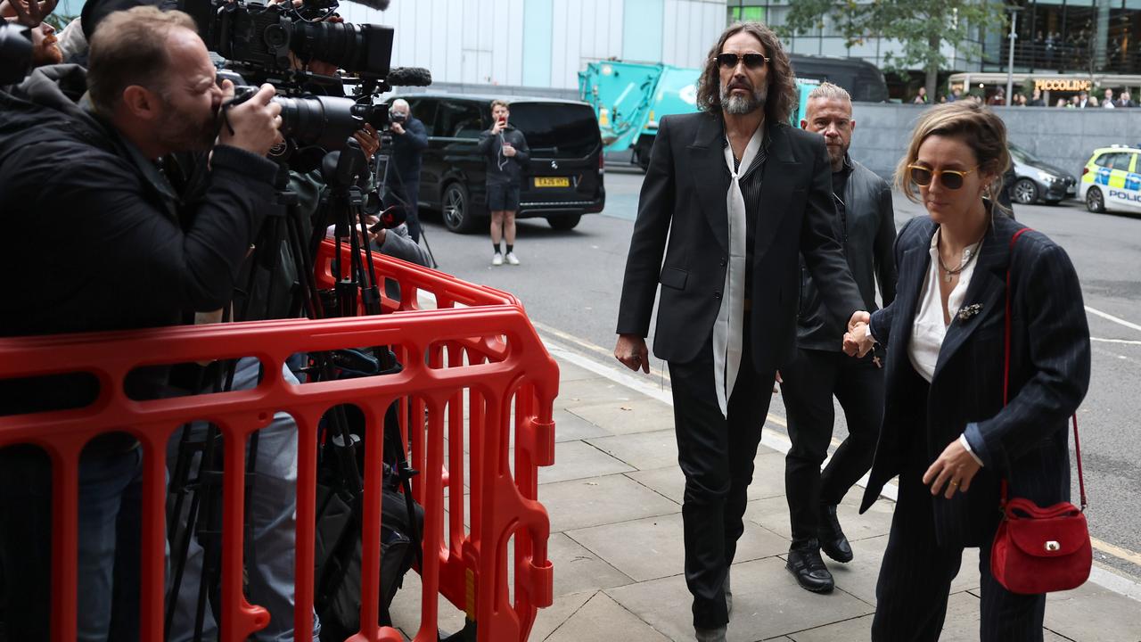 Russell Brand and wife Laura arrive at Southwark Crown Court in London