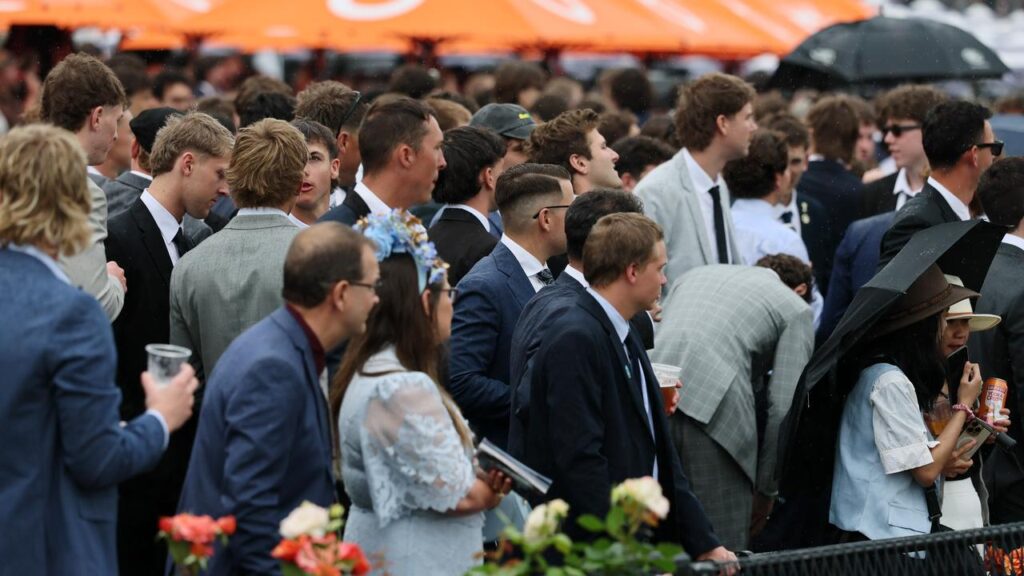 Horse racing fans at Flemington have braved the weather and seen Cosmic Cruasder win the Cox Plate.
