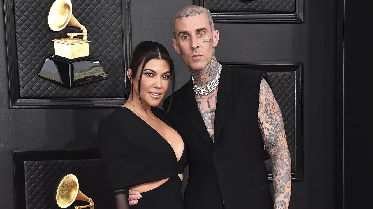 man and woman at grammys