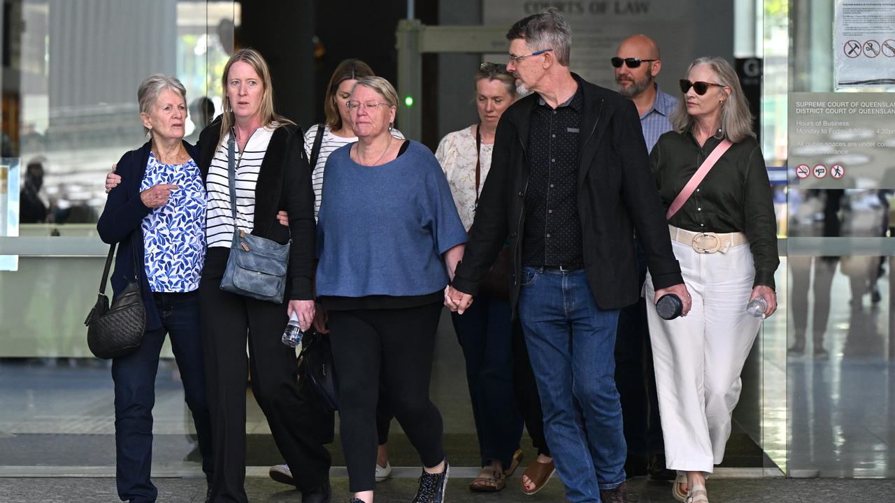 group of people walk out courthouse