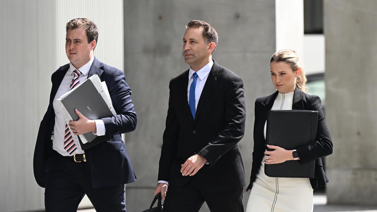 Robert John Crawford with his legal team