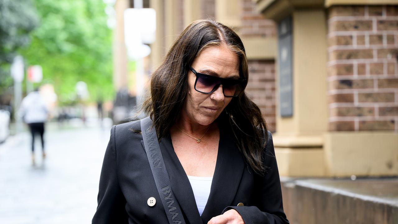 woman leaves courtroom