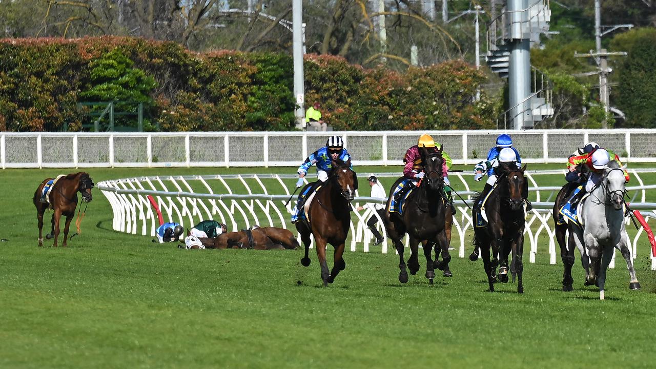 Horses racing.