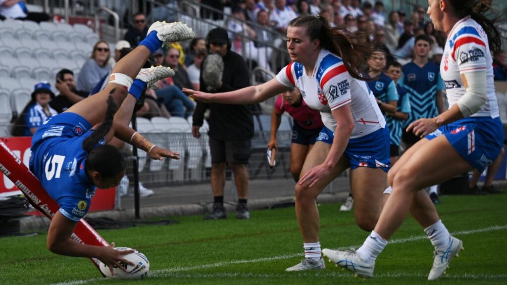 Freedom Crichton Ropati flies in for the first of her three tries for Samoa as they beat England.  
