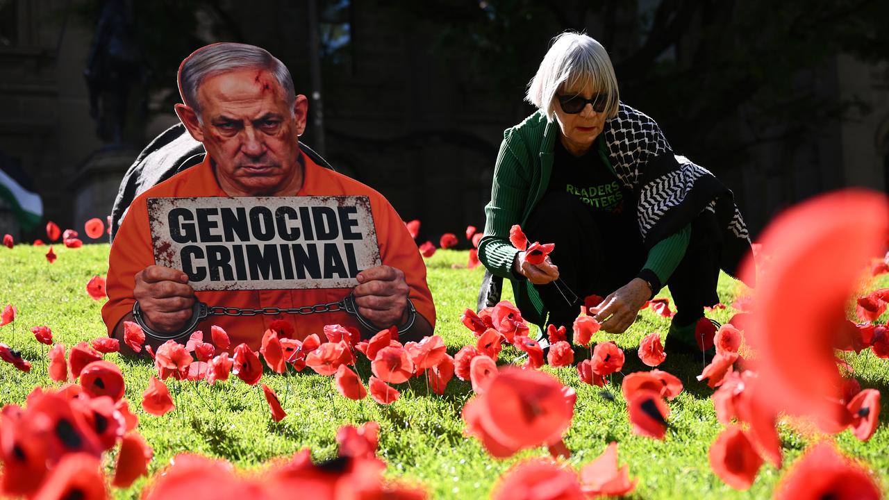 Poppies around a placard featuring Israel PM Benjamin Netanyahu